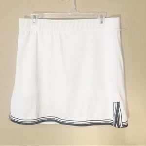 White golf skort with navy trim.  NWT.  Sz Medium